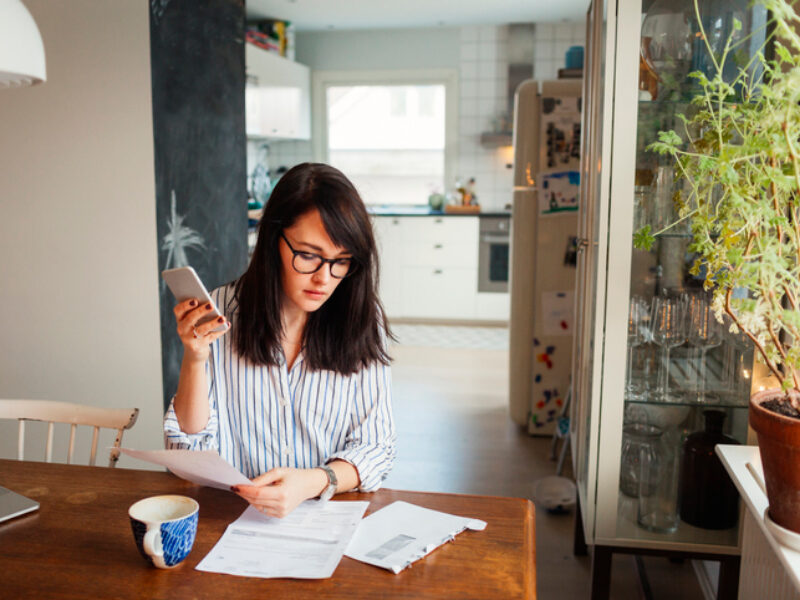 A woman looking into her papers