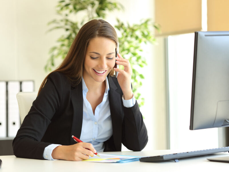 Female office worker on a call