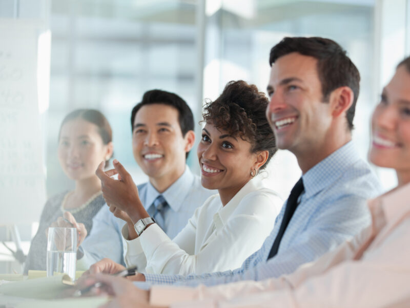 Office employees smiling.