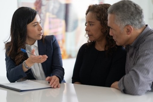 Adviser discussing with a couple